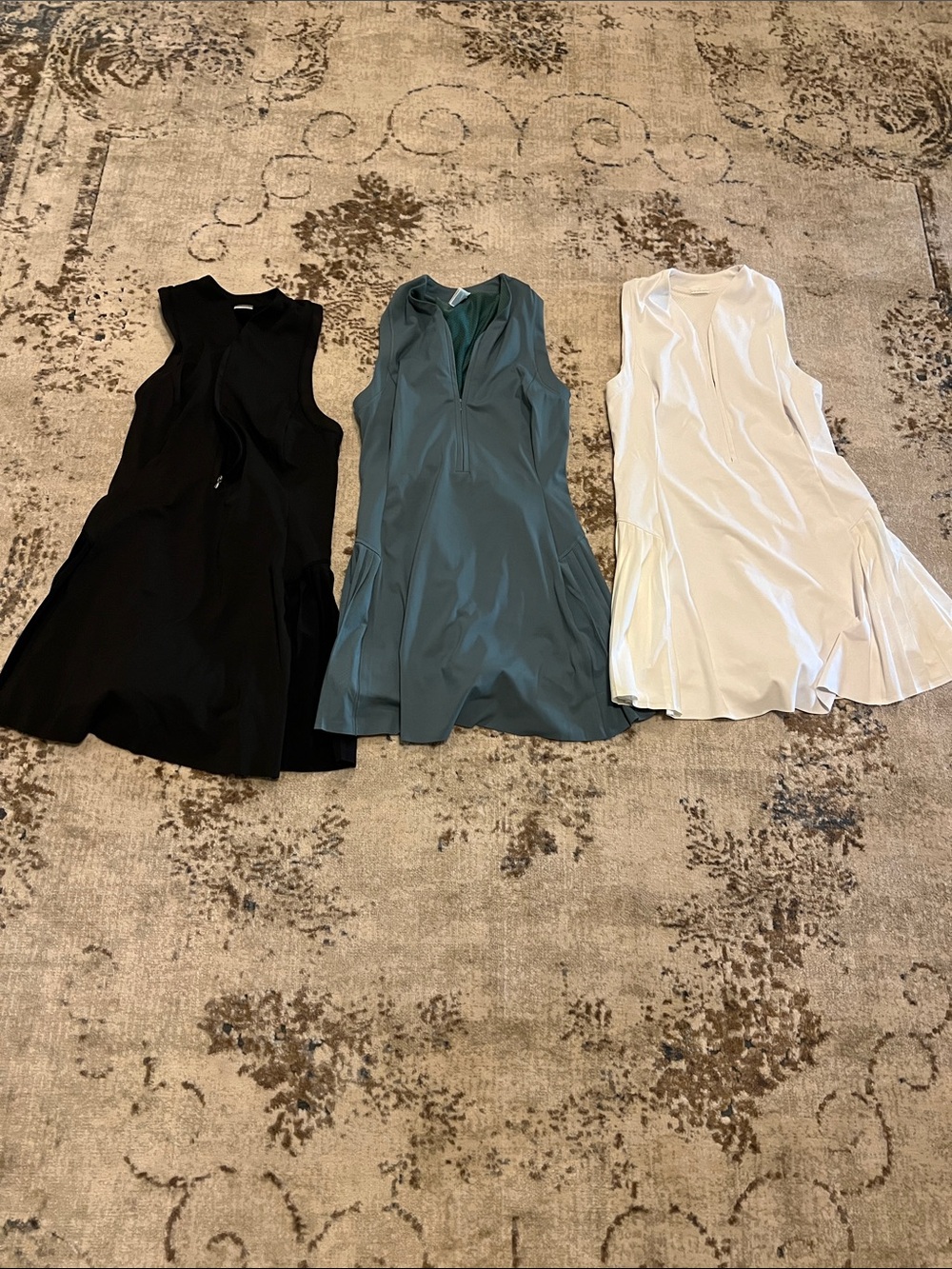 3 Athleta tennis dresses: black, white and Teal. Each 50$